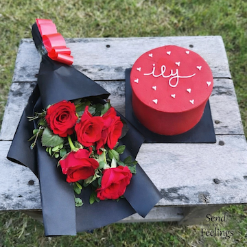 5 red roses bouquet in black wrap with red velvet cake romantic gift combo