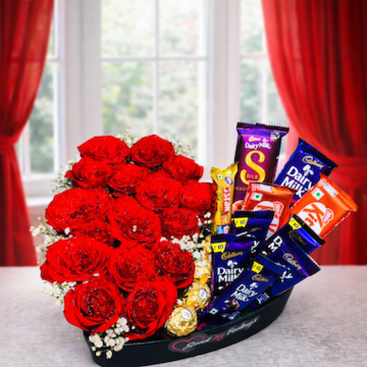 Heart-shaped black basket with red roses and assorted chocolates, romantic gift combo