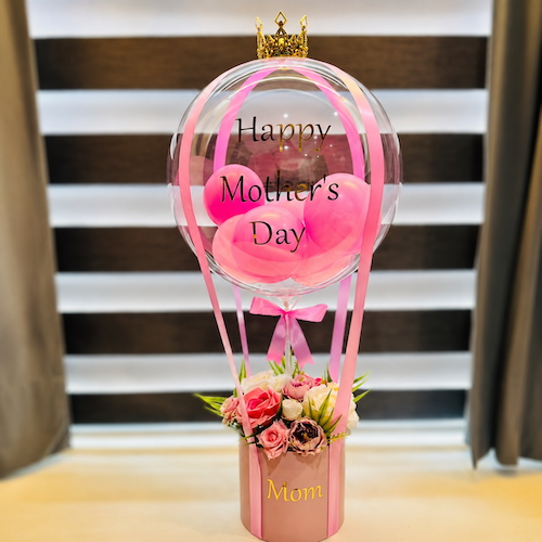 Elegant Mother’s Day bobo balloon bouquet with artificial flowers in pink round box for mom.